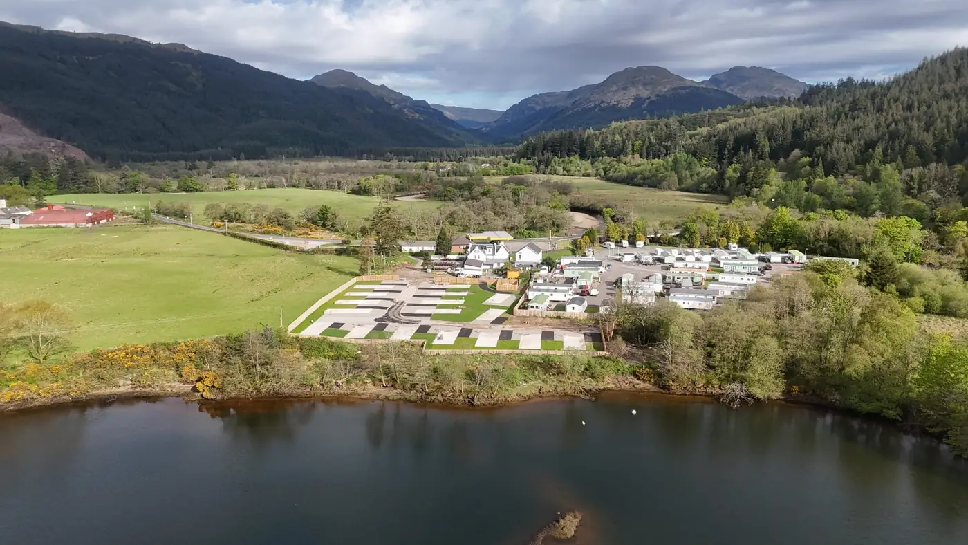 New holiday home development at Cot House by the water, with the Argyll hills behind
